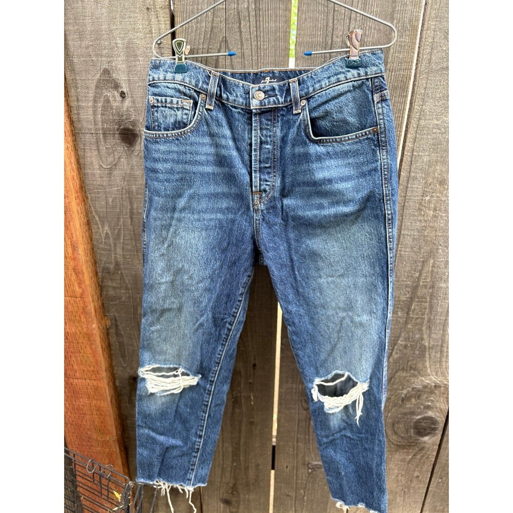 7 For All Mankind medium wash blue jeans with a distressed straight-leg design